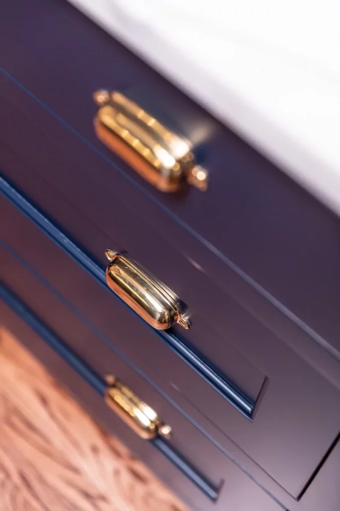 Blue cabinet drawers with gold handles