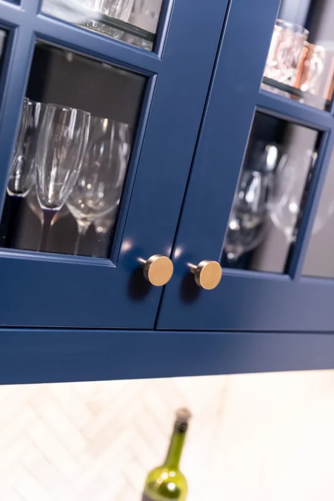 Blue cabinets with glass viewing panes