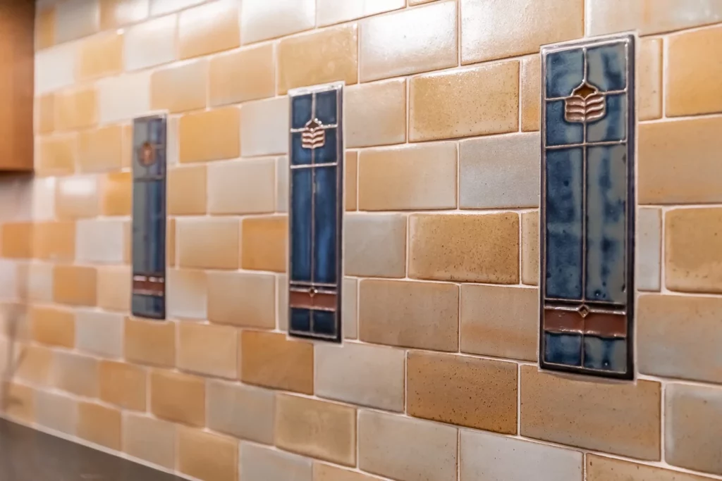 Custom tile designs within a kitchen backsplash