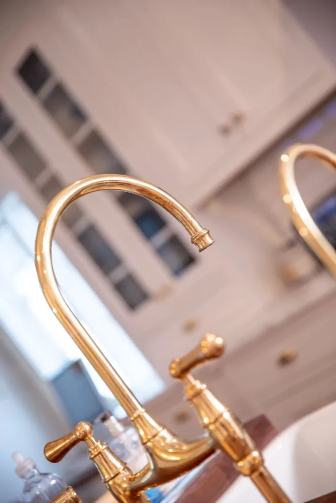 Gold colored kitchen faucet