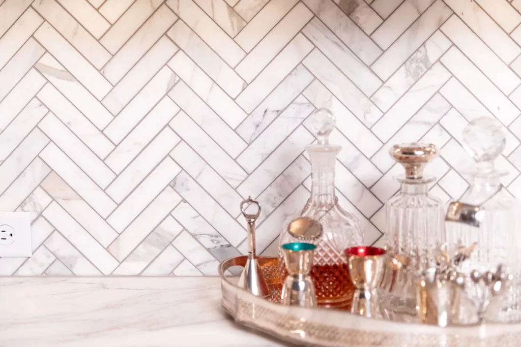 Marble tile arranged in a herringbone pattern